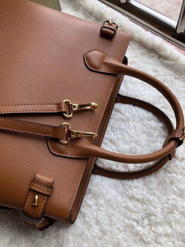 B**rry the medium banner in leather and house check