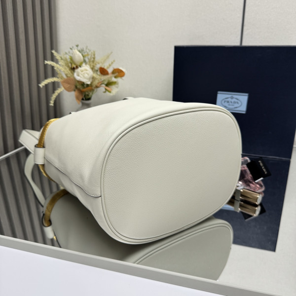 Pra*a buckle leather bucket bag with jeweled belt