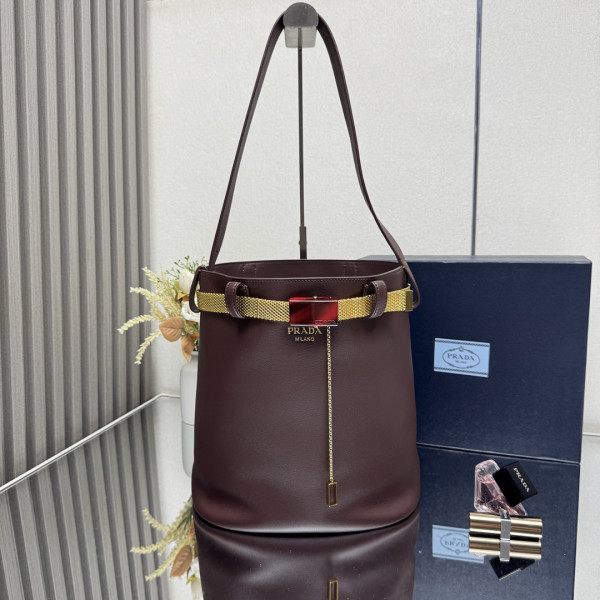 Pra*a buckle leather bucket bag with jeweled belt